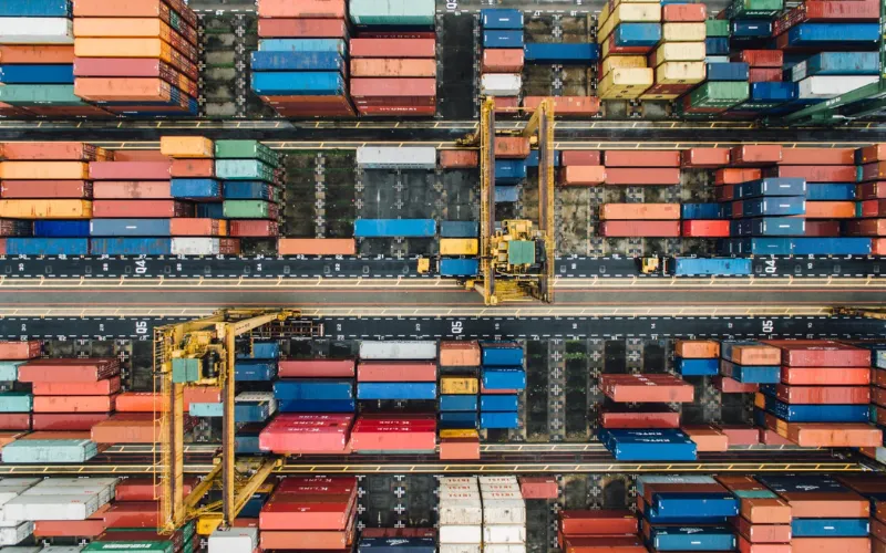 Overhead view of a container yard and gantry cranes